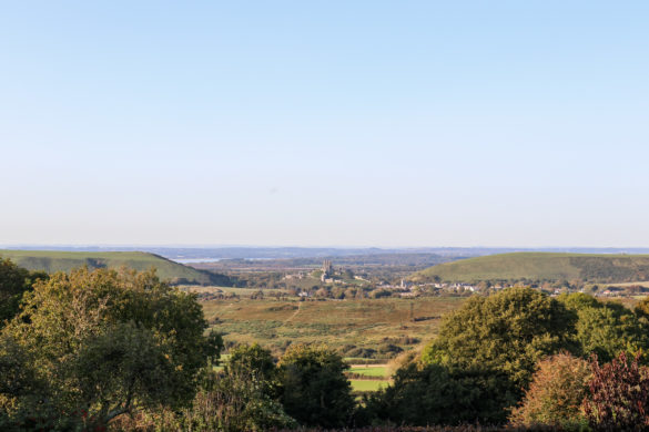 Corfe Castle and village in gap between Purbeck Hills