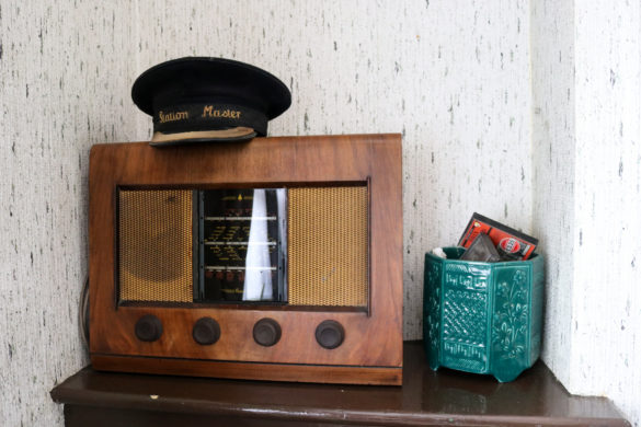 Station master's hat on vintage radio in Corfe Castle station