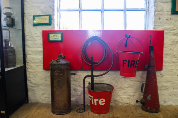 Vintage fire buckets display at Corfe Castle station