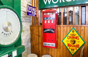 Vintage cigarette dispenser and signage at Swanage Railway museum