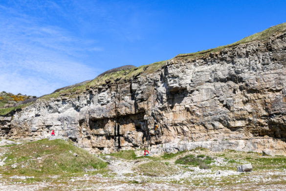 People climbing the cliffs of Dancing Ledge