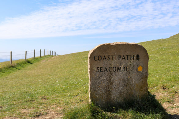 Stone sign for Seacombe and the South West Coast Path at Dancing Ledge