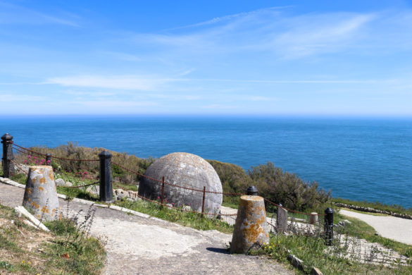 Durlston's globe viewed from the path by Durlston Castle