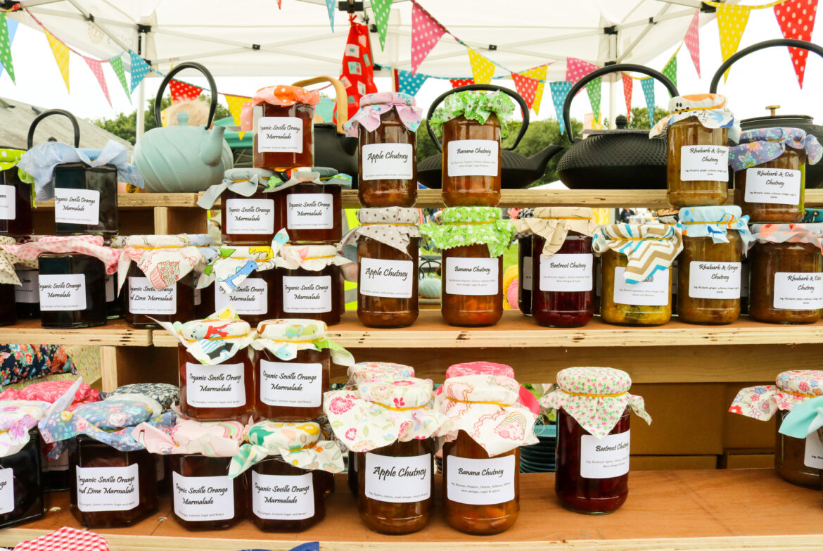 Jars of handmade jams, marmalade and chutney at a village fair