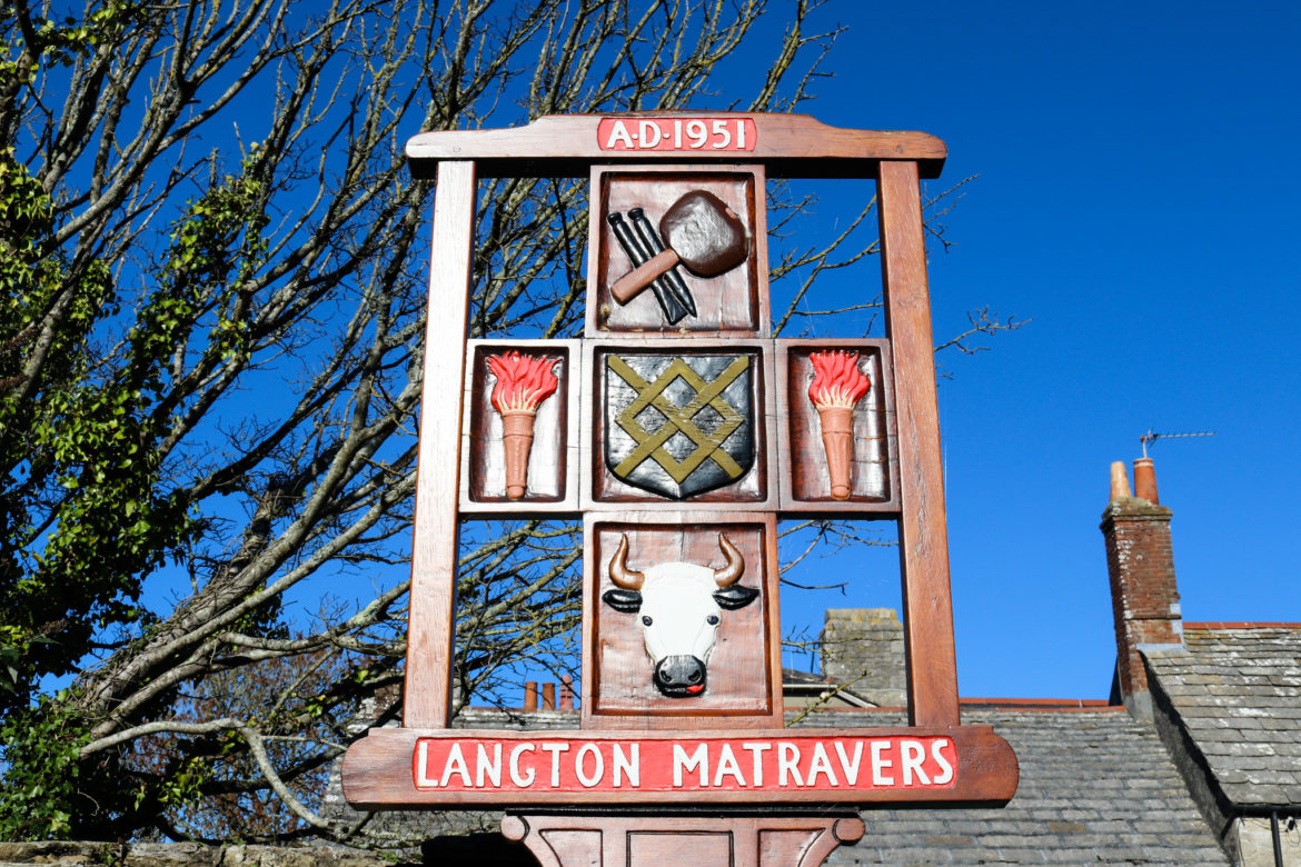 Painted wooden sign for Langton Matravers village