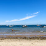 Boats in the sea at Studland's South Beach