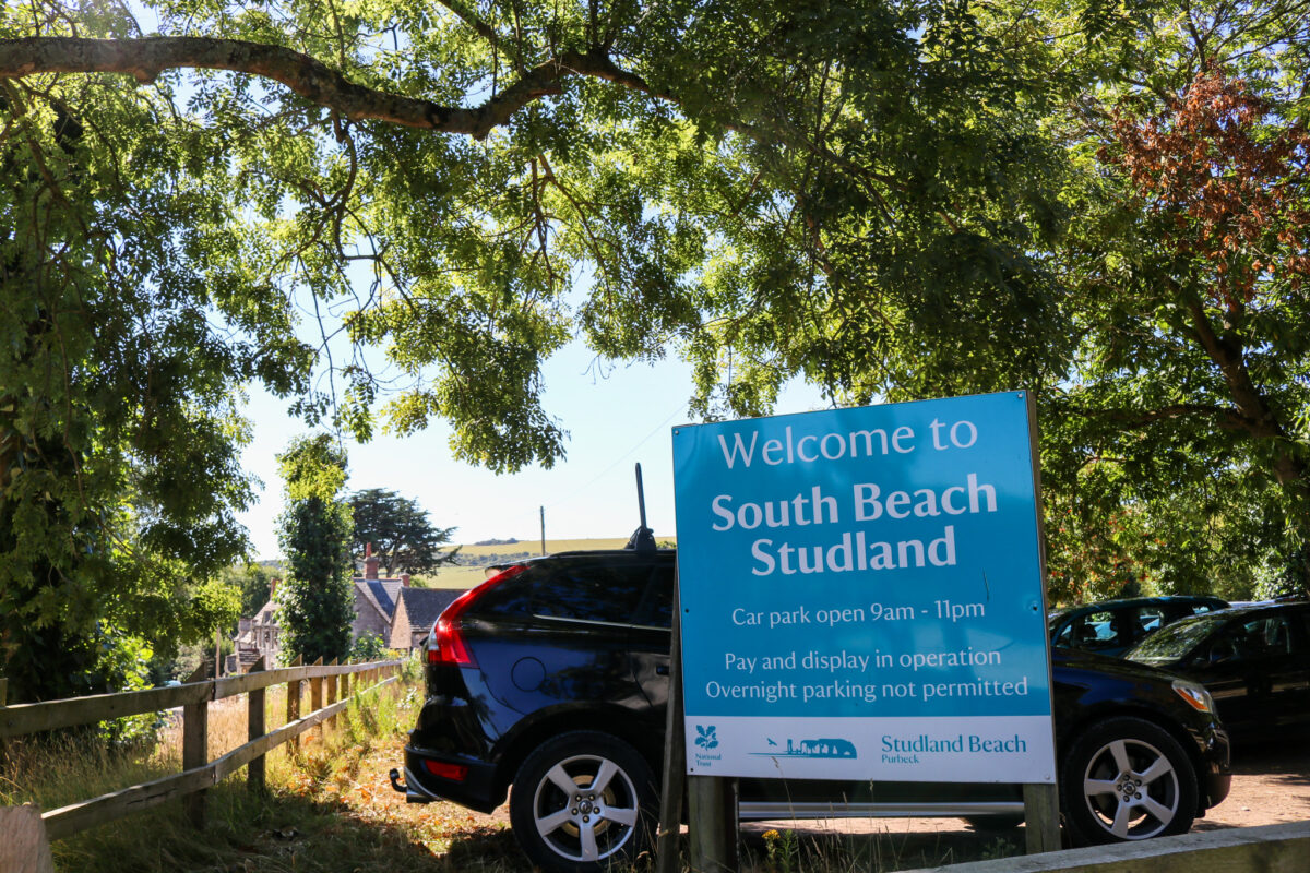 Welcome to South Beach Studland sign in car park