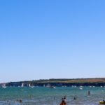 People in the sea at Knoll Beach in Studland