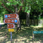 Signs for the beach on Rectory Lane in Studland
