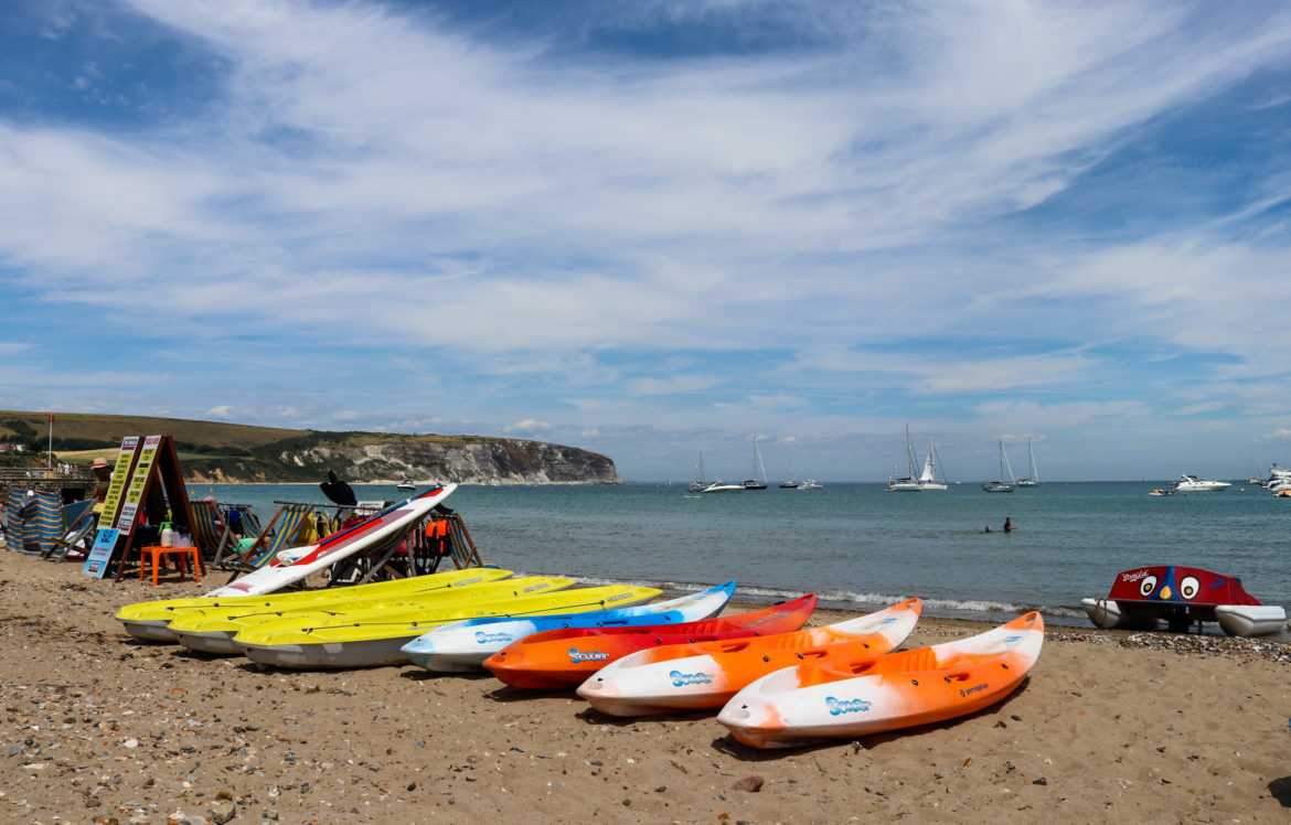 Kayaks and pedalo on Swanage beach