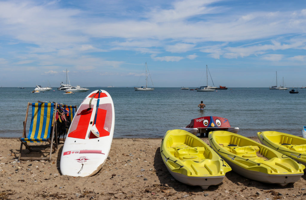 Paddle board and kayaks on Swanage beach