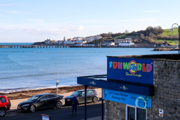 K's Funworld sign in front of Swanage Bay