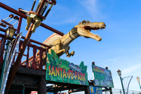 Dinosaur at entrance to Santa Fe fun park in Swanage
