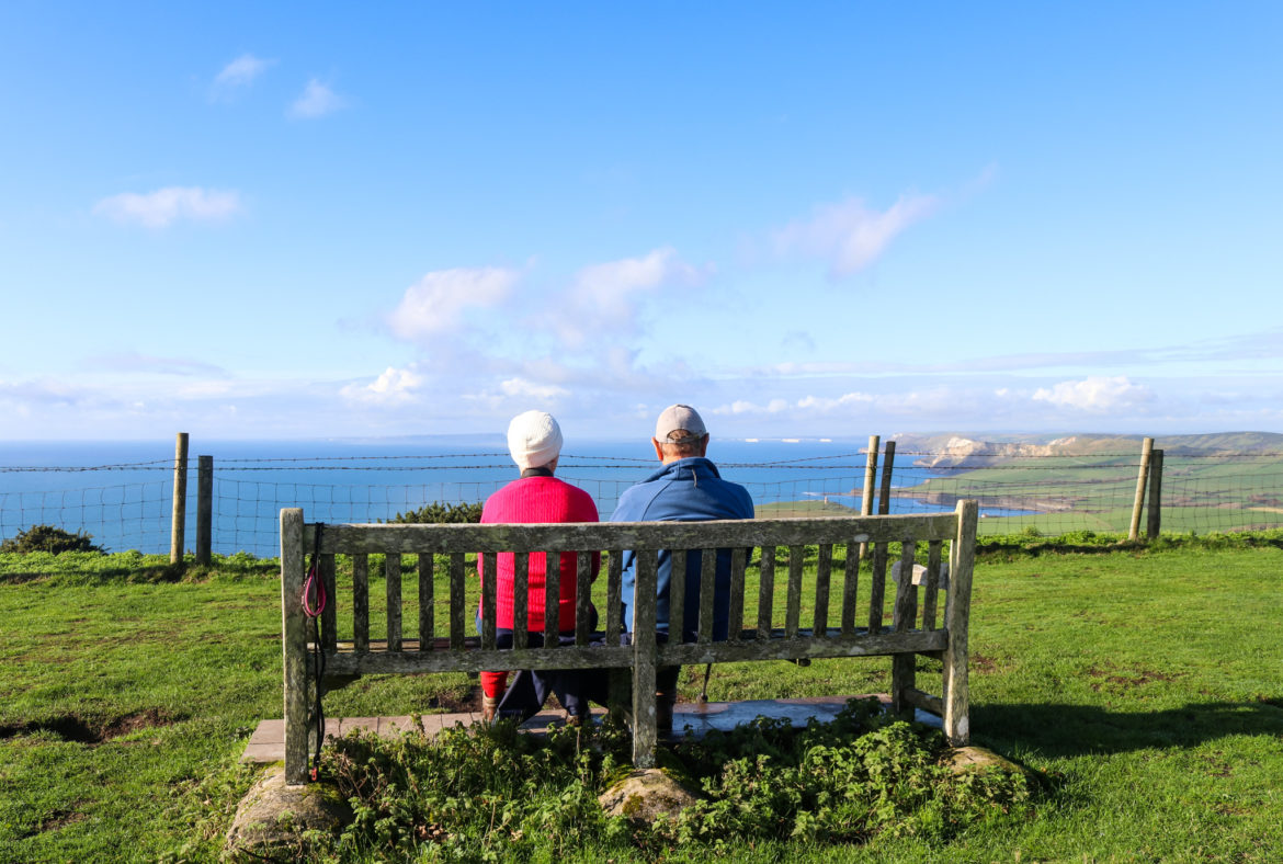 Couple sitting on a bench at Swyre Head