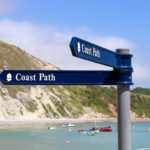 Lulworth Cove coast path signs