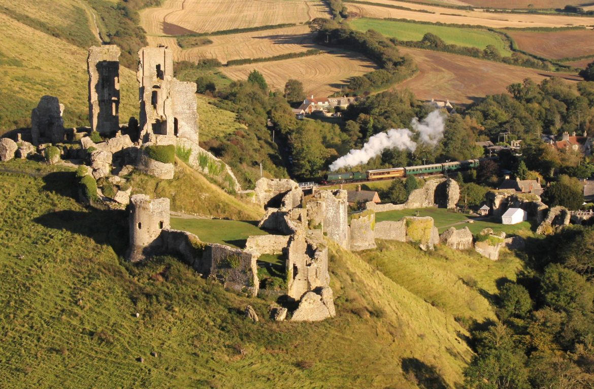 Arial view of Corfe Castle and Swanage steam train