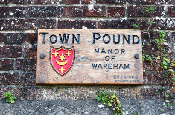 Wareham Town Pound sign on brick wall
