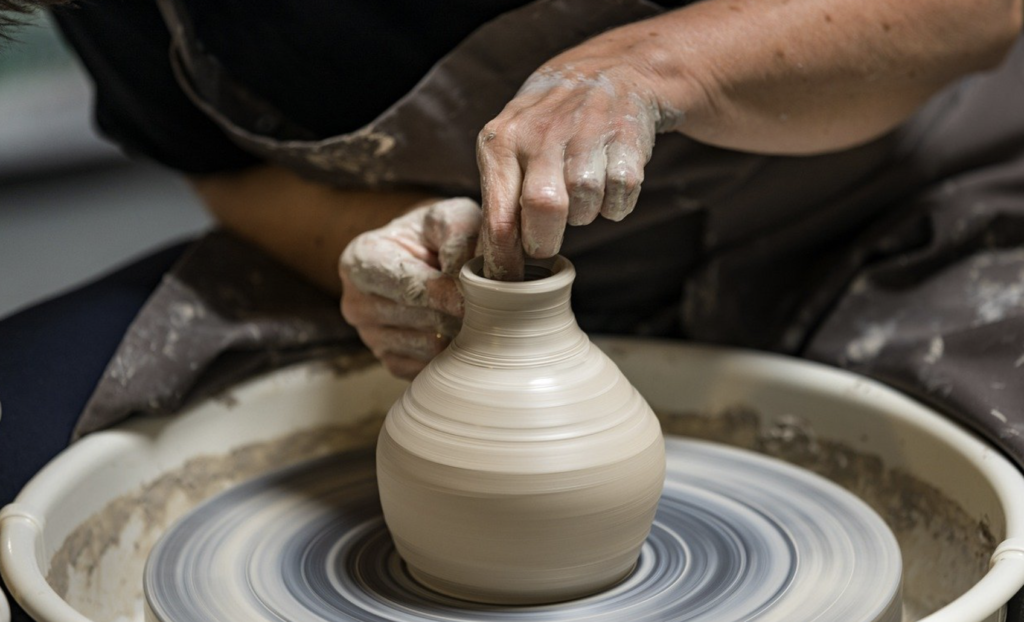 Clay pot on pottery wheel 