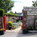 The Greyhound Inn beer garden entrance in Corfe Castle