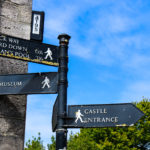 Signs to castle and museum in Corfe Castle