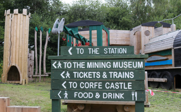 Norden station sign next to playground