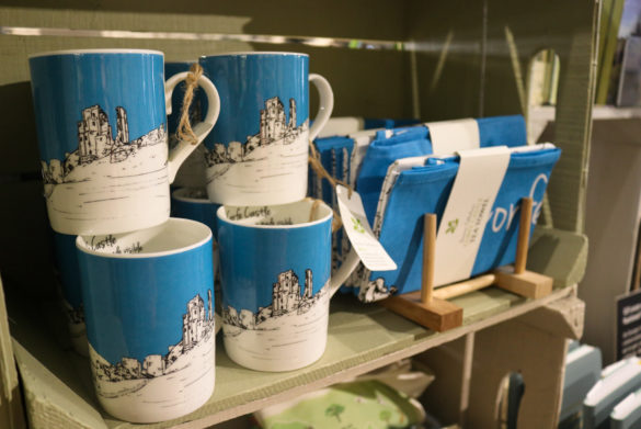 Blue and white Corfe Castle illustration on mugs and tea towels