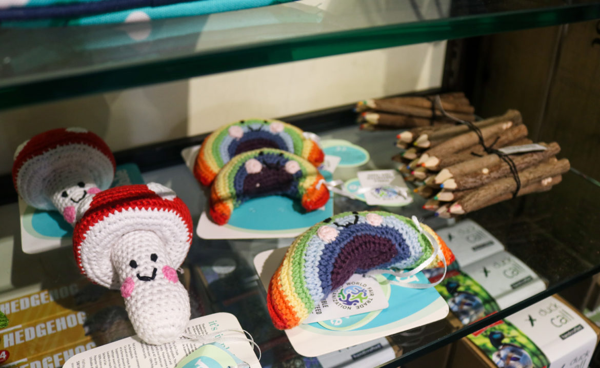 Knitted mushroom and rainbow toys on shelf in Corfe Castle shop