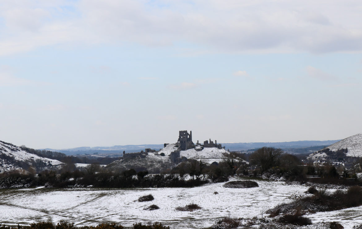 Corfe Castle in the snow view from common