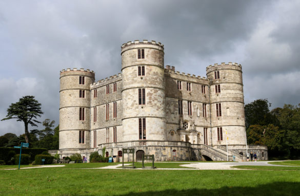 Stocks outside Lulworth Castle with cloudy sky