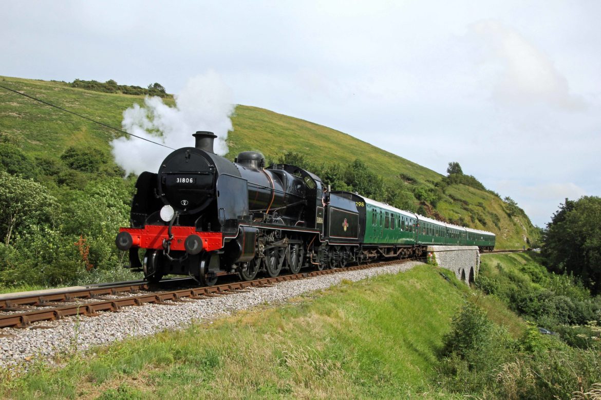 No. 31806 steam train passing through Purbeck Hills