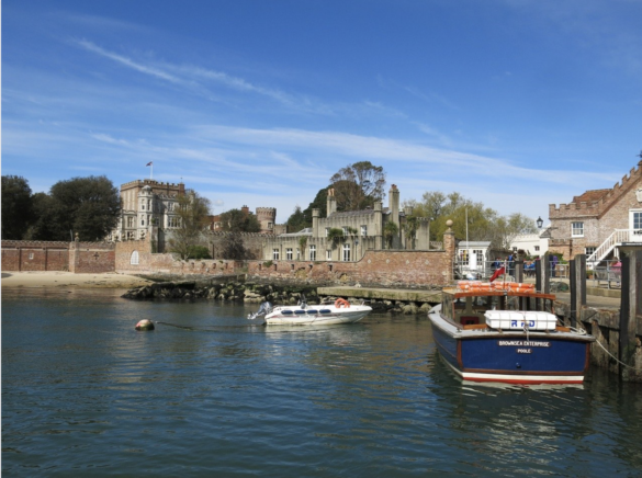 Boats in harbour in front of Brownsea Castle