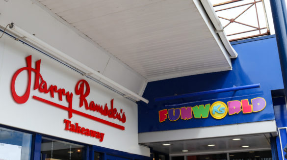 Signage for Harry Ramsden's takeaway and K's Funworld in Swanage