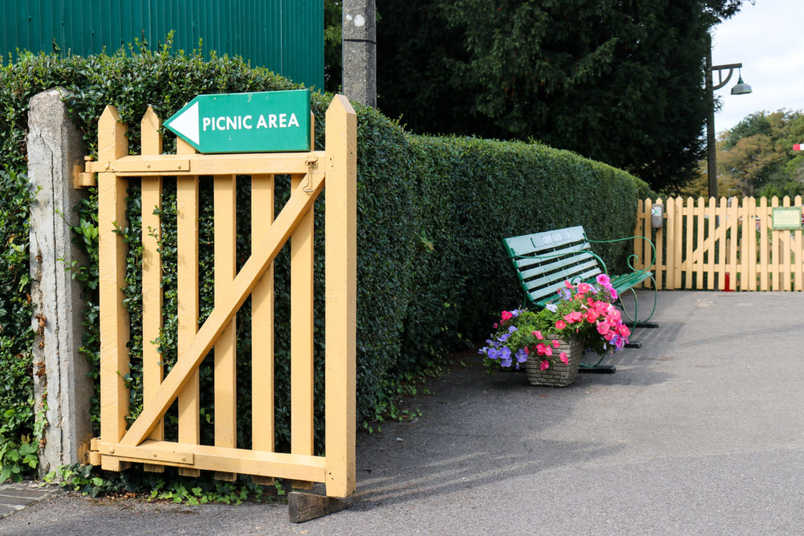 Corfe Castle railway station station picnic area sign and bench
