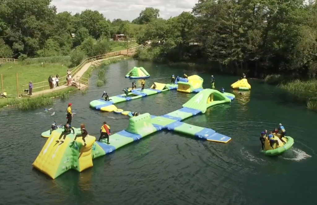 People on the inflatable course at Dorset Adventure Park