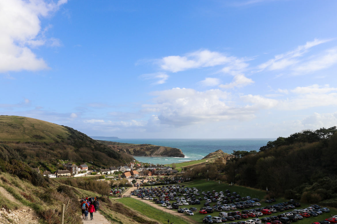 People walking down the path by the overflow car park in Lulworth Cove from from Durdle Door