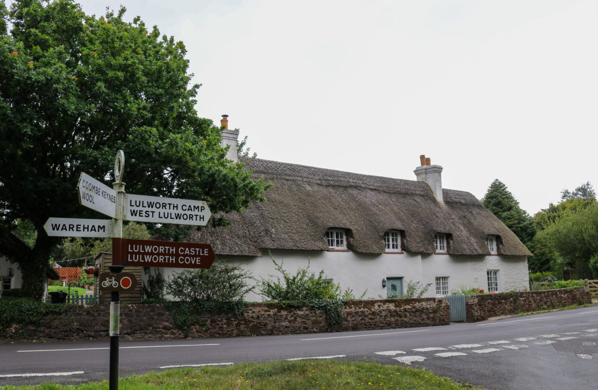 Signage in front of thatched cottage in East Lulworth village