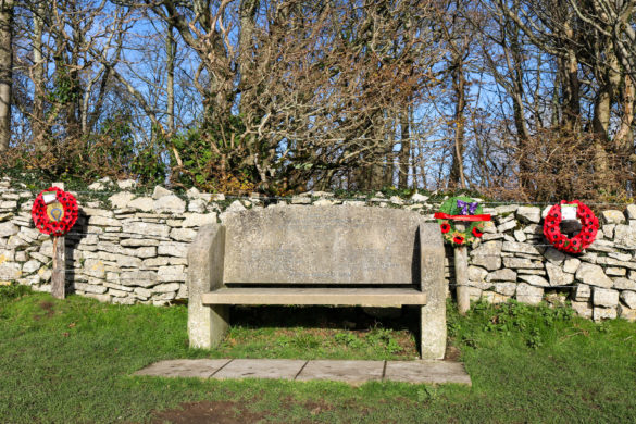Aircraft disaster Remembrance bench with poppy wreaths on path to Swyre Head