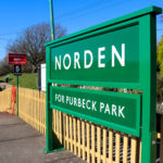 Norden for Purbeck Park sign on station platform