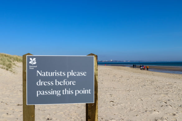 Sign on Studland Naturist beach asking people to dress past this point