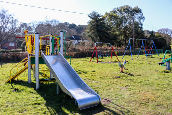 Slide and swings in the playground at Studland