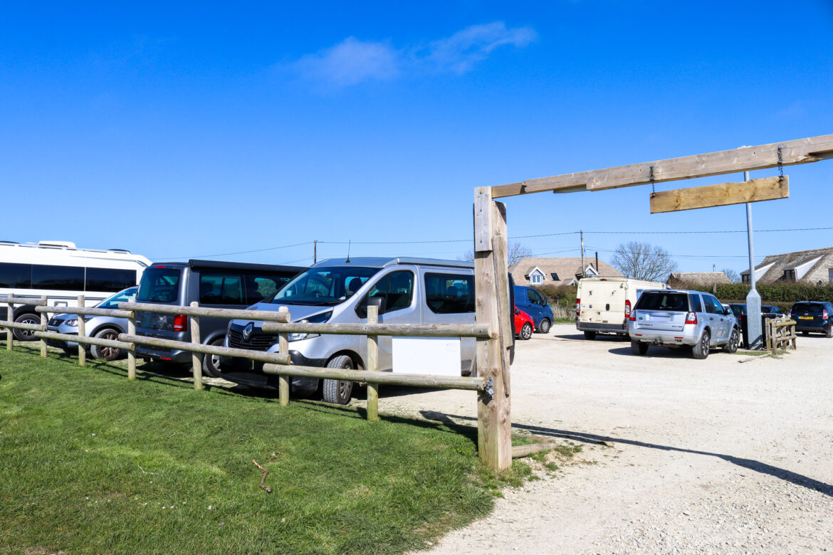 Cars in the village car park at Worth Matravers
