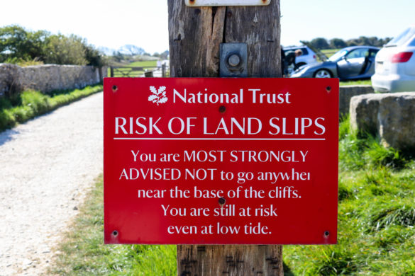 Risk of land slips National Trust sign at Spyway car park for Dancing Ledge