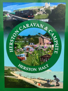 Herston Caravan & Campsite sign for Herston Halt at Harman's Cross station