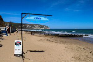 Sign for beach café and bar The Cabin in Swanage