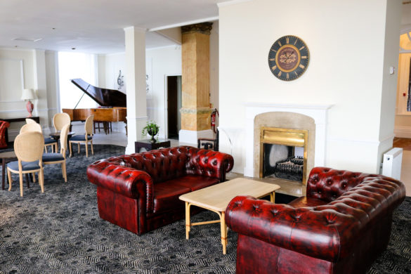 Leather sofas and grand piano in the lounge, Grand Hotel, Swanage