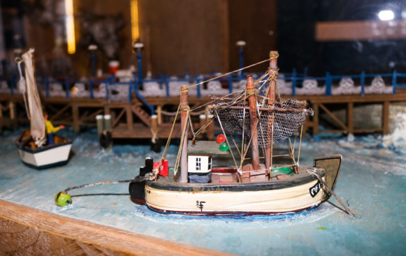 Miniature model fishing boat, part of a display at Swanage Pier