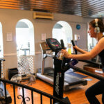 Woman on exercise bike at the Grand Hotel