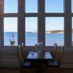 Table set for dinner at The Grand with view over Swanage Bay