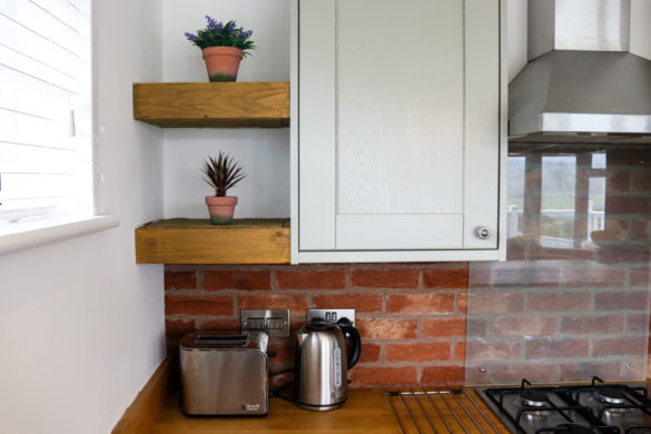 Toaster, kettle and welcoming plants in holiday home at Swanage Coastal Park