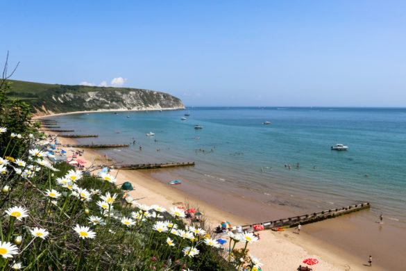 Holidaymakers on the beach below the Grand Hotel in Swanage